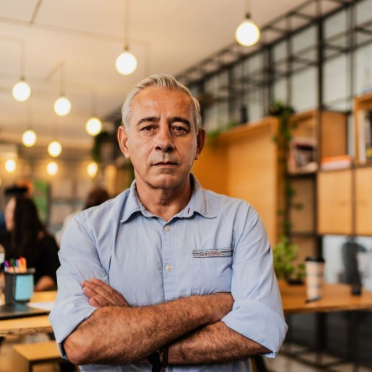 Man with unreadable expression looking into camera